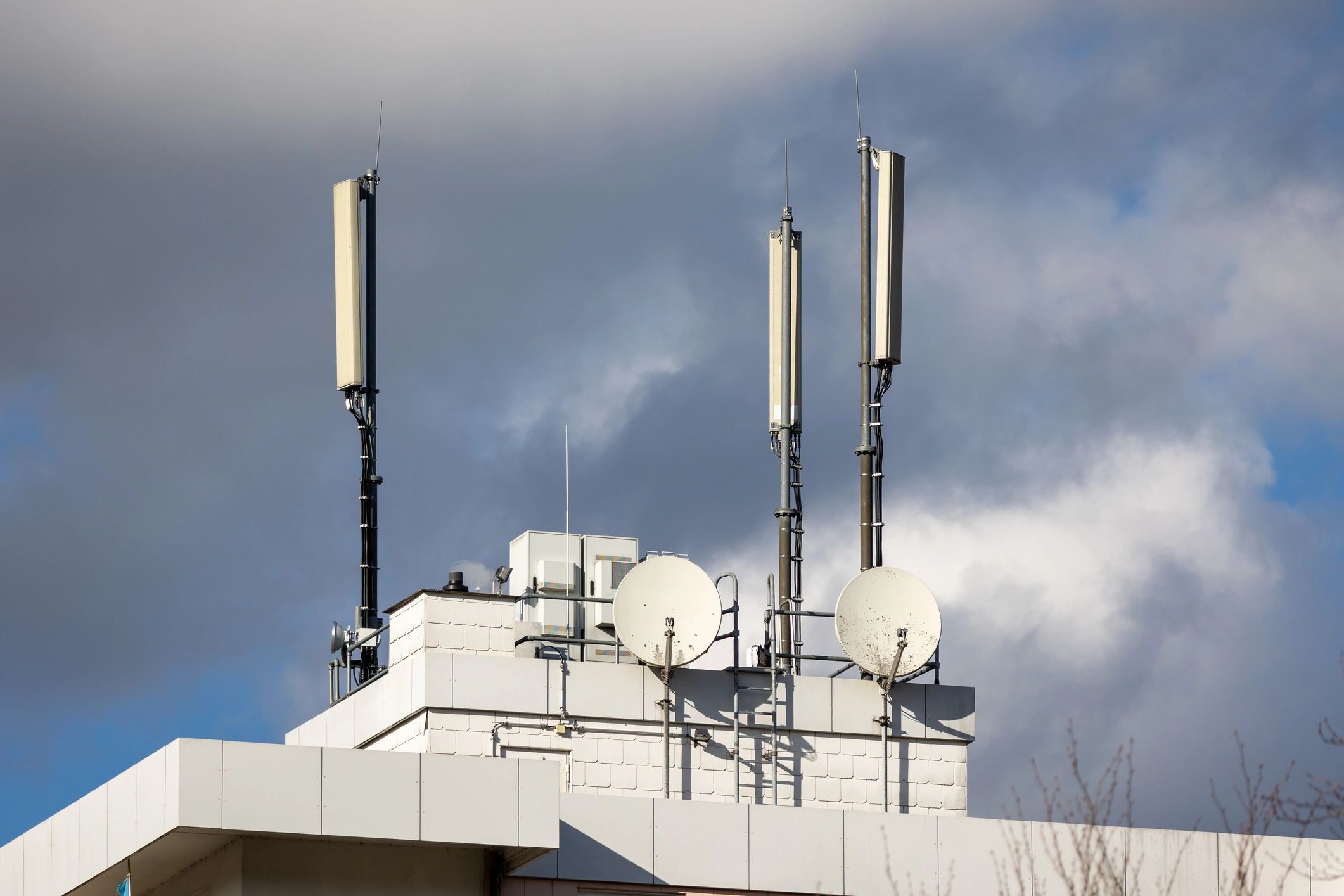 Telecom rooftop antennas representing backup power monitoring for communications sites